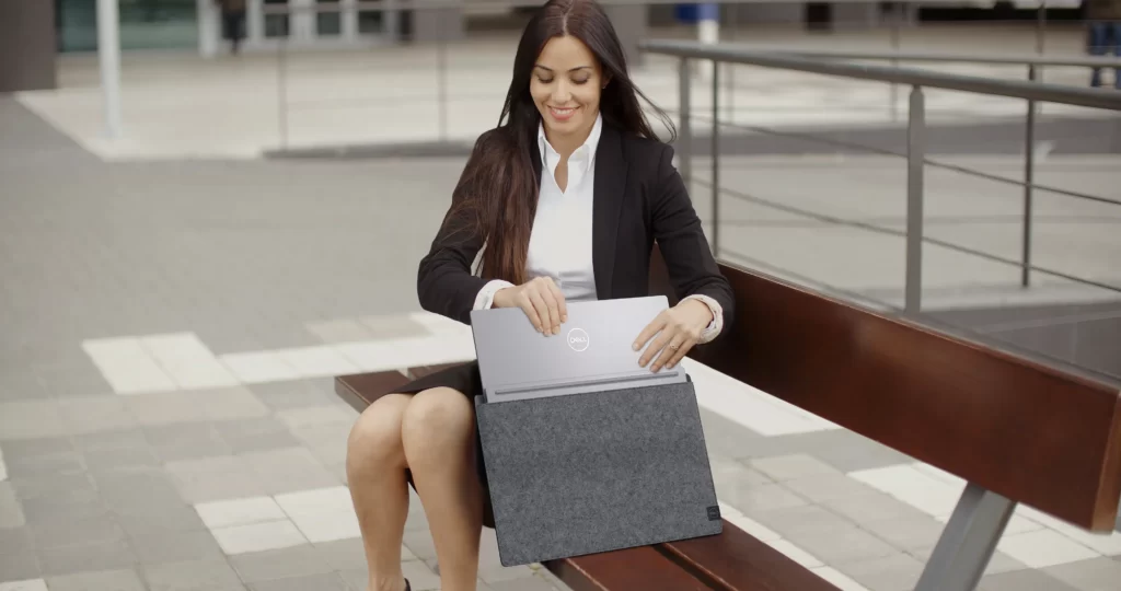 woman with laptop in-sleeve